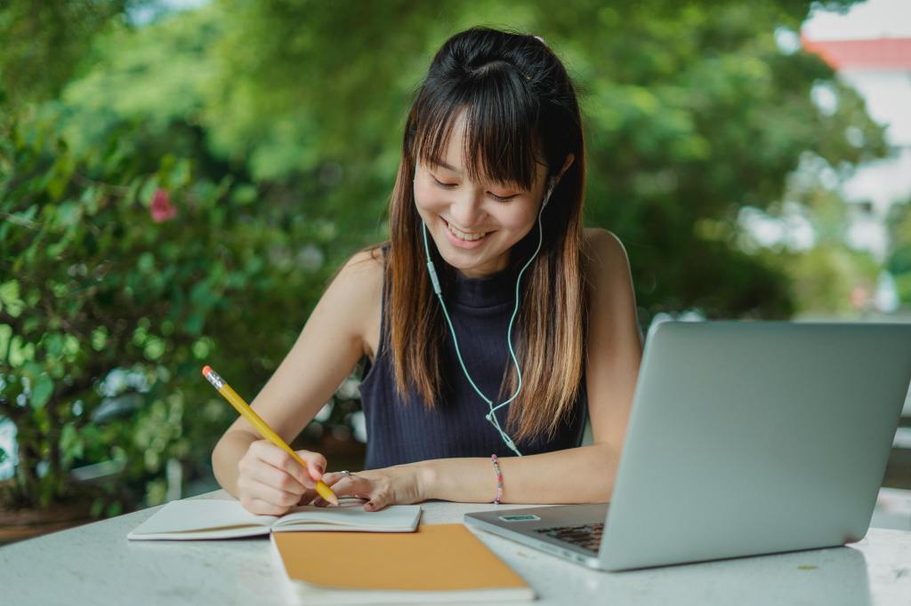 Is she smiling because the homework is easier? (Pexels)